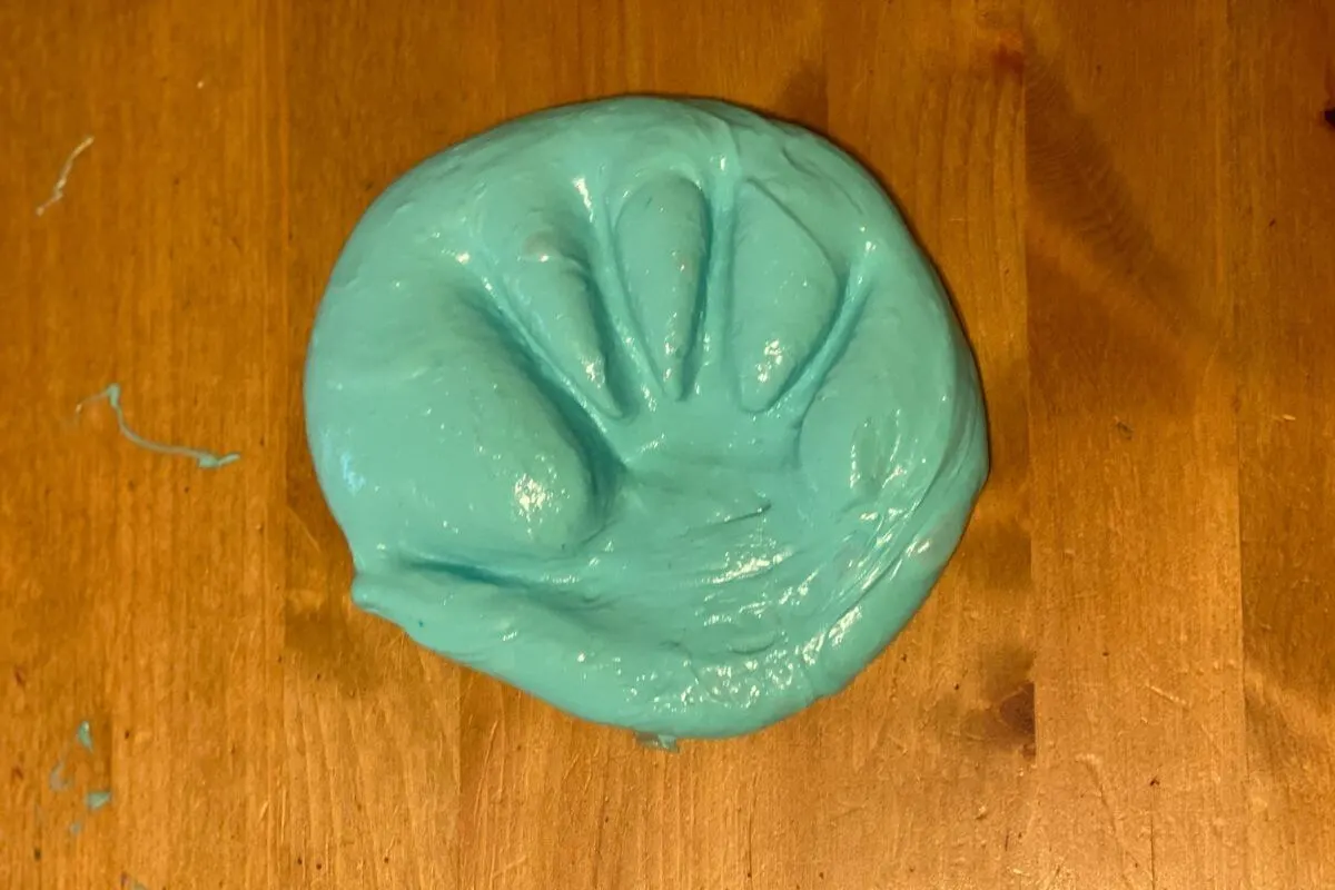 Blue slime handprint