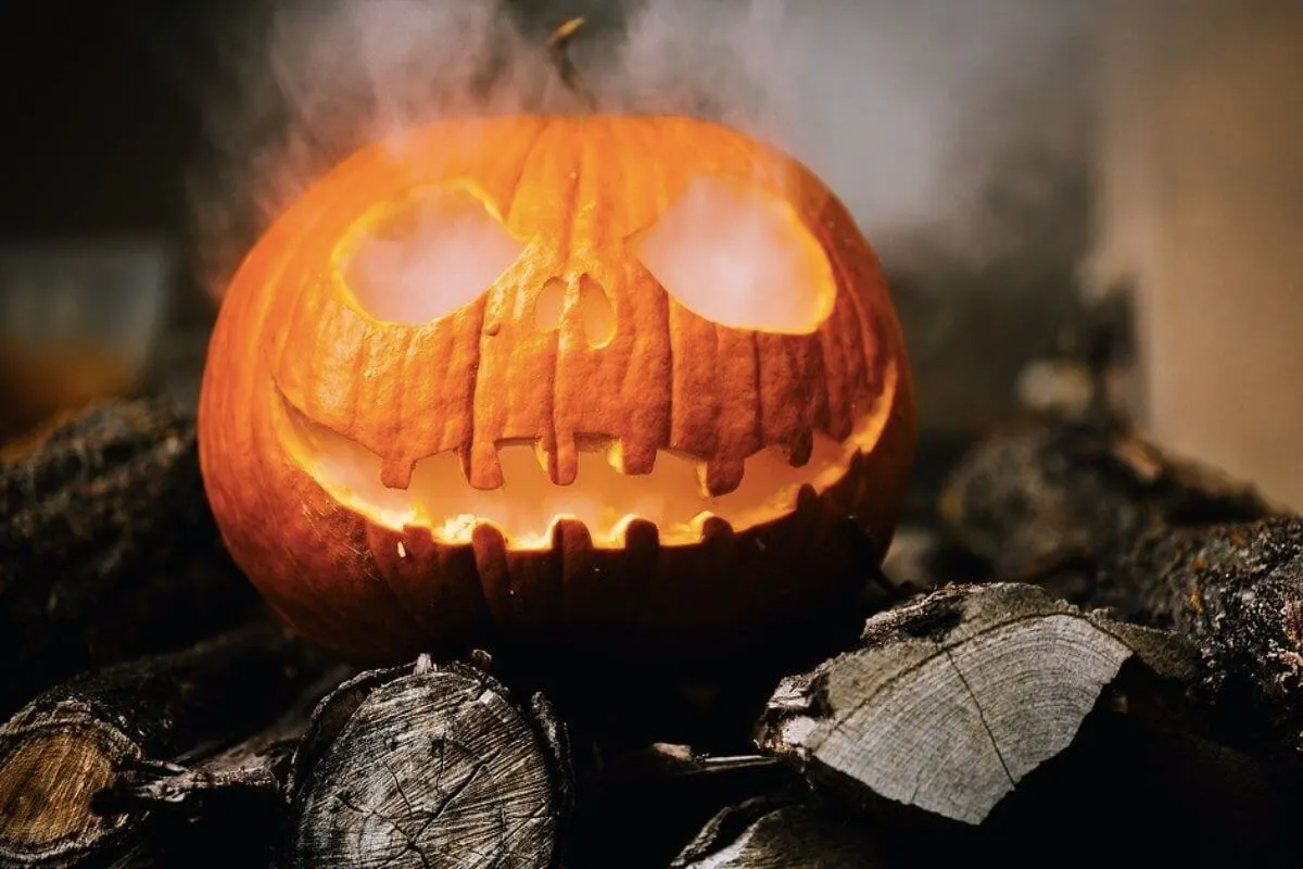 Carved pumpkin with smoke coming out of it's eyes