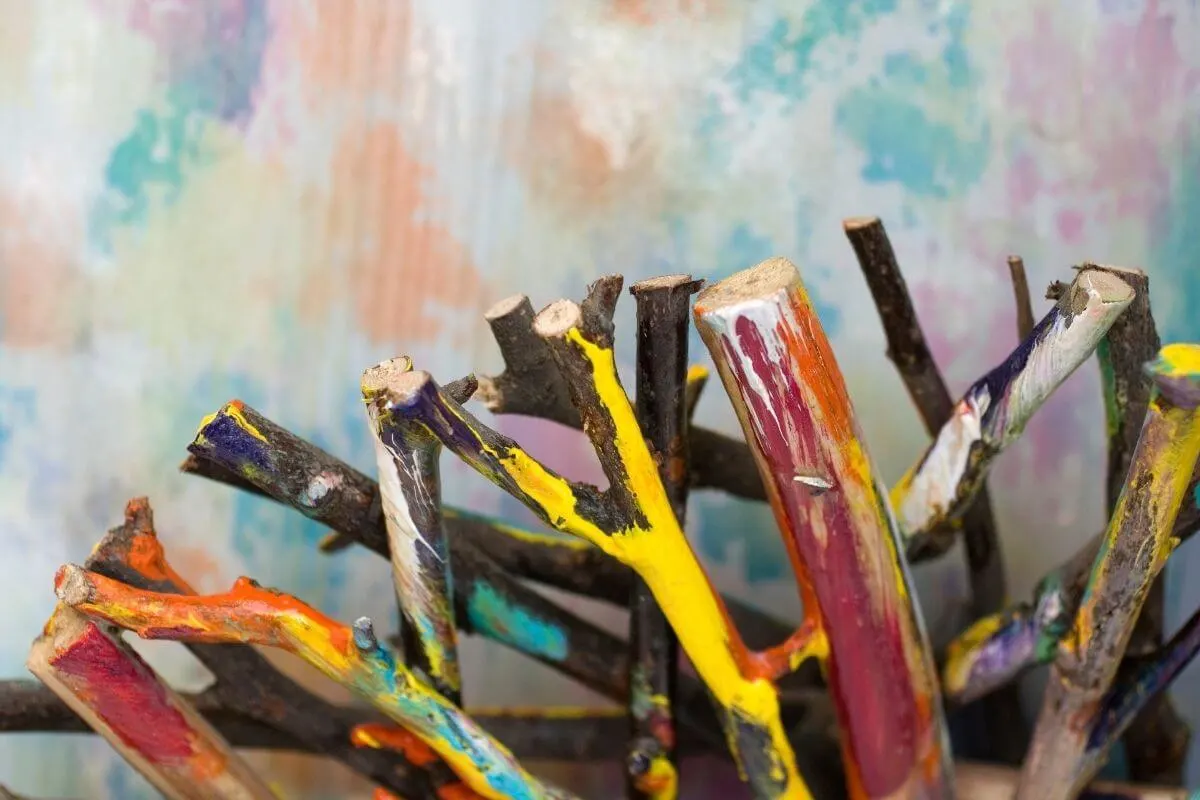 Painted sticks on a coloured background