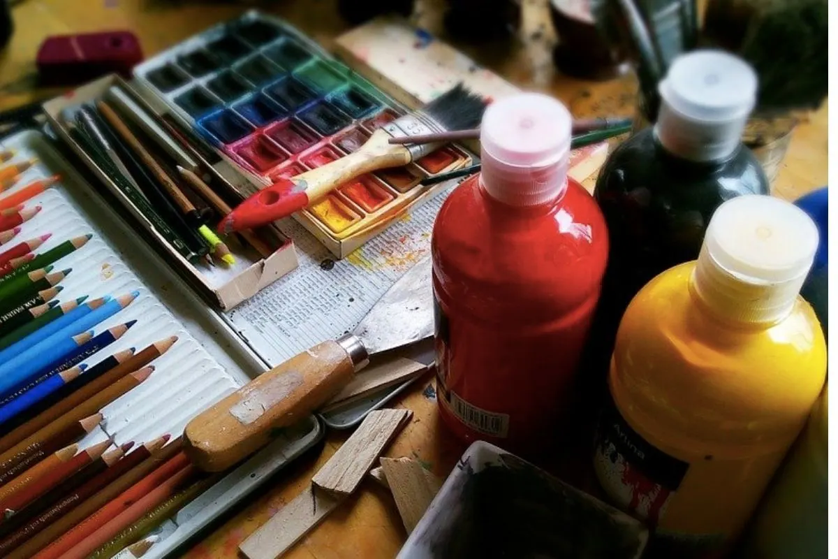 Paint and brushes on a desk